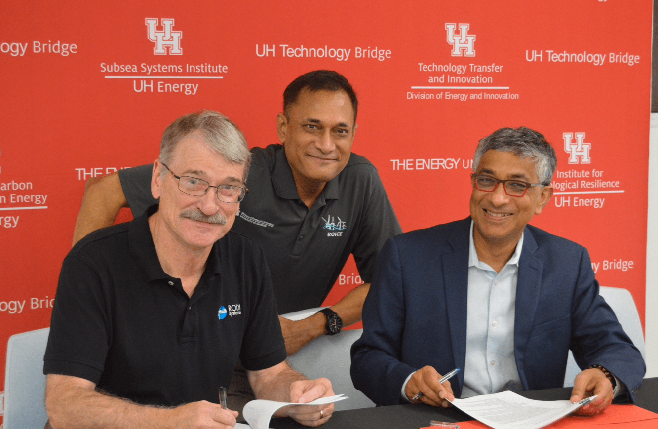 Rodi Systems new sponsors smile in a picture with the ROICE Program director. 